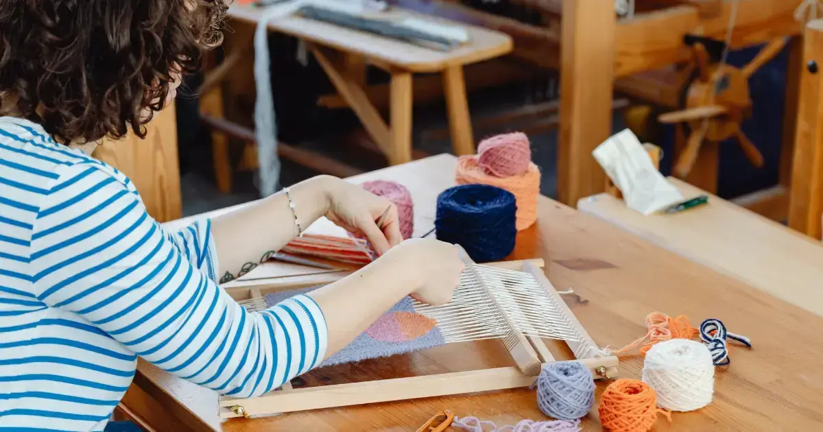 Woman doing a craft with thread