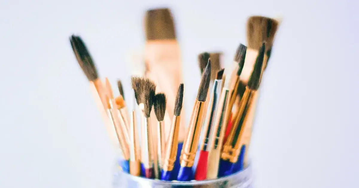 paint brushes in a jar