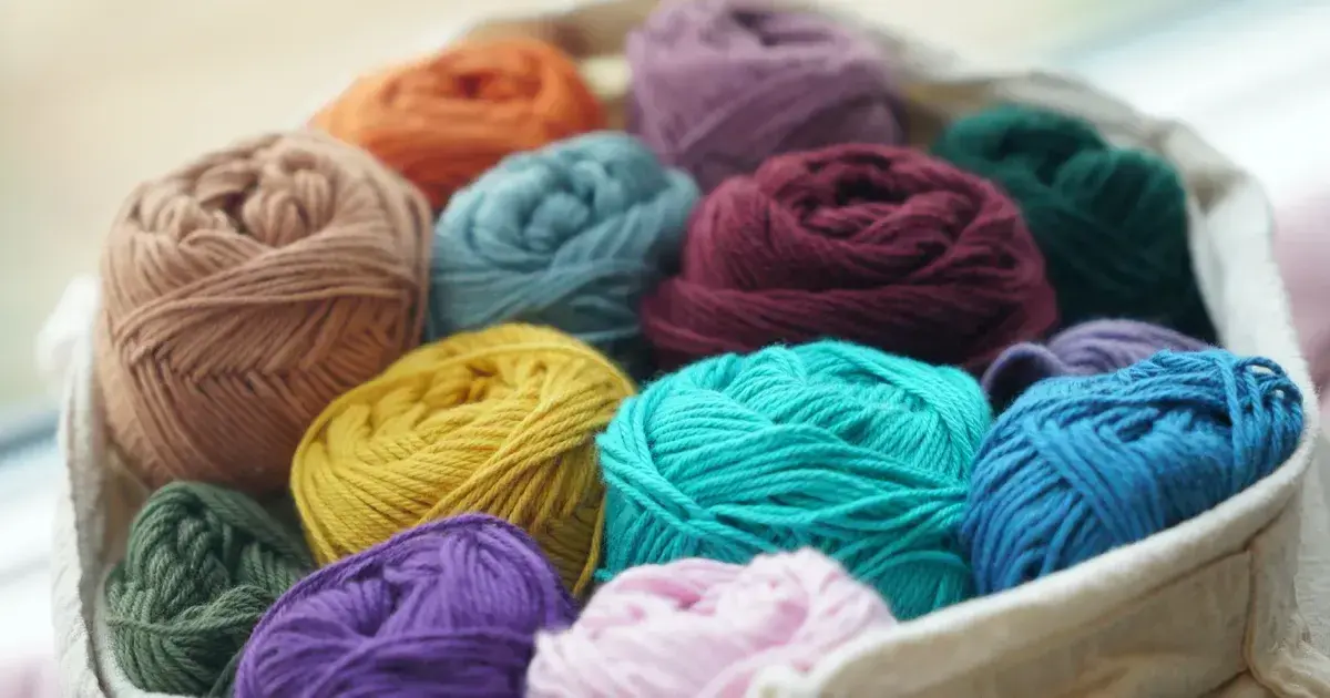 spools of yarns in a bin